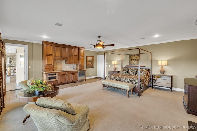 carpeted bedroom featuring crown molding and ceiling fan