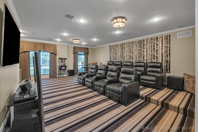 cinema featuring ornamental molding and carpet flooring