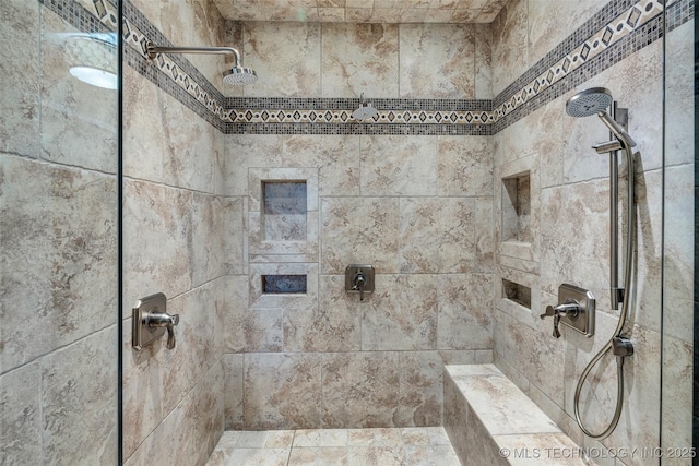 bathroom with tiled shower