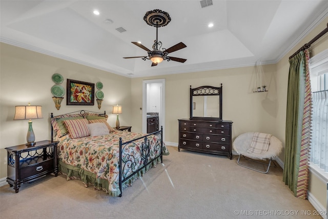 bedroom with crown molding, a tray ceiling, multiple windows, and light colored carpet