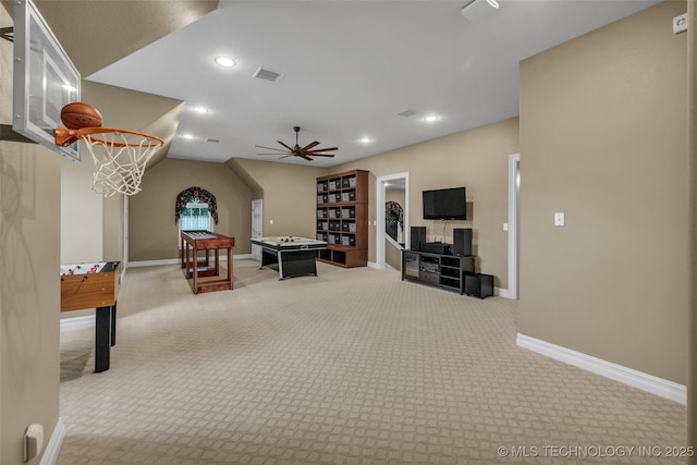 recreation room with light colored carpet and ceiling fan