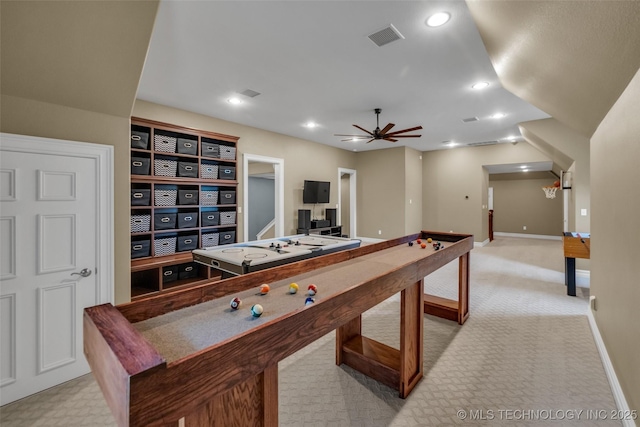 playroom with ceiling fan and light colored carpet