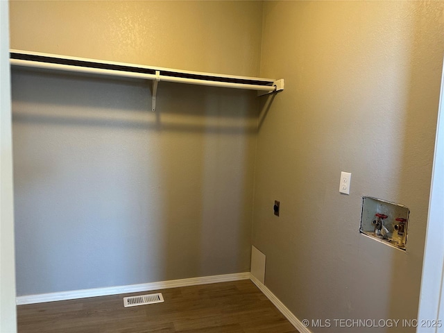 washroom with hookup for a washing machine, wood-type flooring, and electric dryer hookup