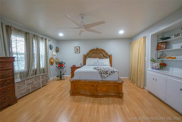 bedroom featuring light hardwood / wood-style floors and ceiling fan