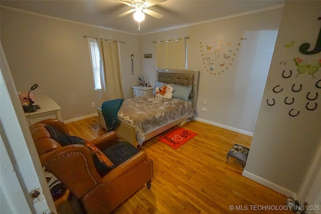 bedroom with ceiling fan, ornamental molding, and hardwood / wood-style floors