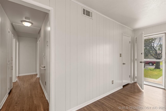 corridor featuring dark hardwood / wood-style flooring