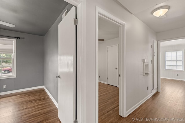 hall with hardwood / wood-style flooring