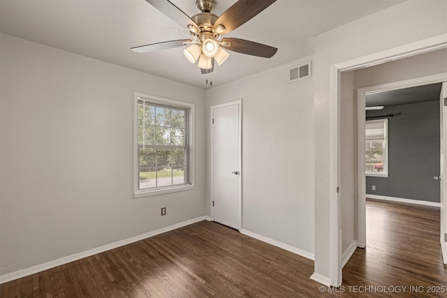 unfurnished bedroom with dark wood-type flooring and ceiling fan