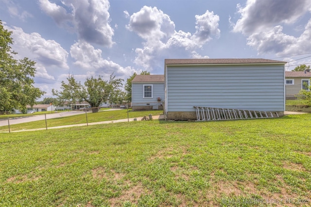 view of side of home featuring a yard