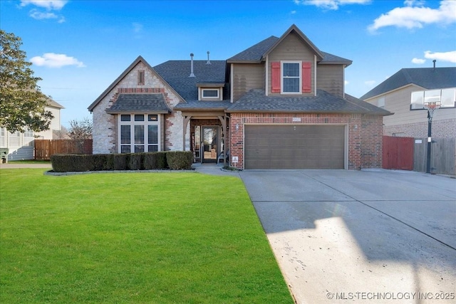 view of front of home featuring a garage and a front yard