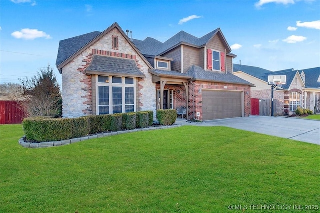 view of property featuring a garage and a front lawn