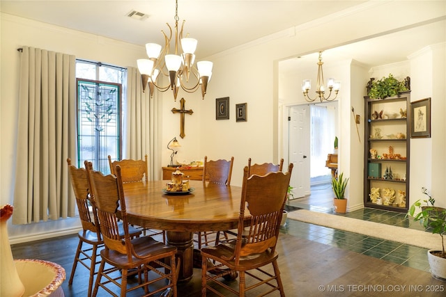 dining area with crown molding and a chandelier