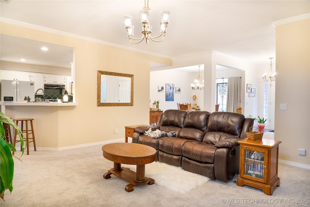 living room featuring ornamental molding, light carpet, and a notable chandelier