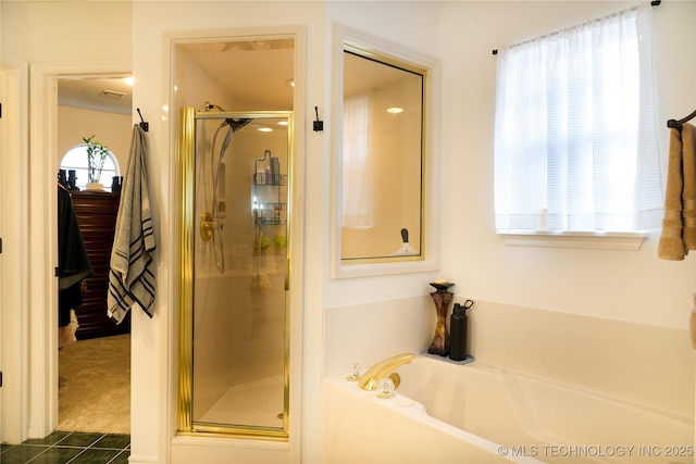 bathroom with tile patterned flooring, a wealth of natural light, and plus walk in shower