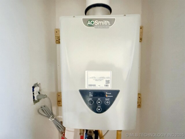 utility room with tankless water heater