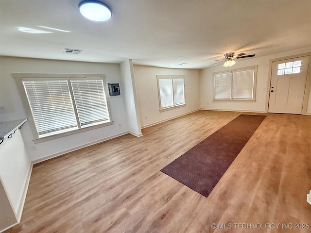 interior space featuring ceiling fan and light hardwood / wood-style flooring