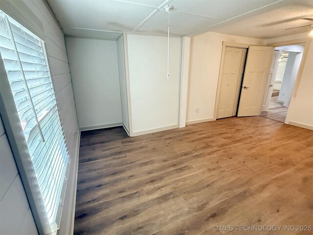 spare room with hardwood / wood-style flooring and a wealth of natural light