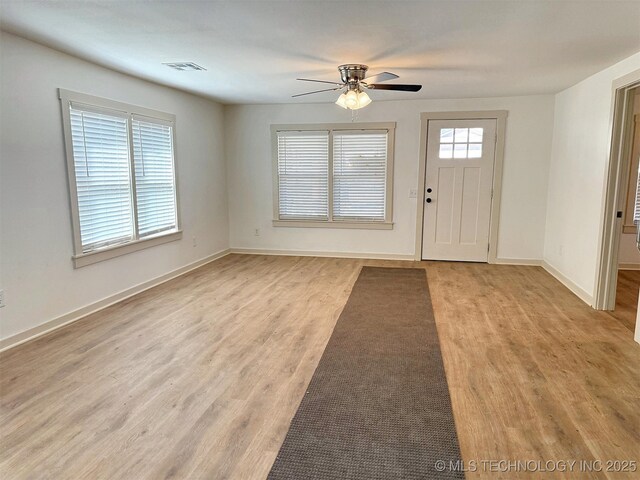 foyer featuring ceiling fan and light hardwood / wood-style flooring