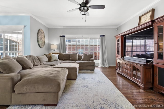 living room featuring crown molding, a healthy amount of sunlight, ceiling fan, and dark hardwood / wood-style floors