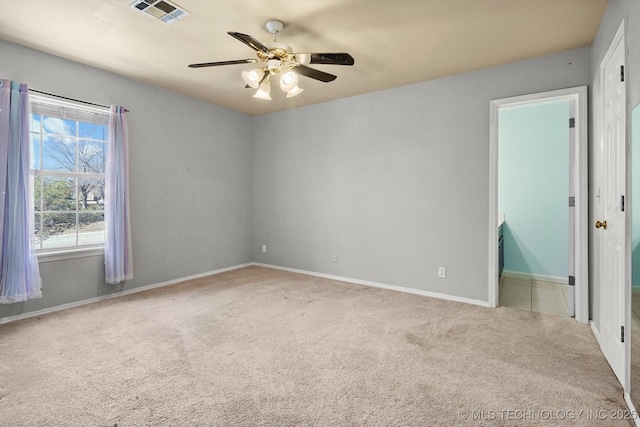 empty room with light carpet and ceiling fan