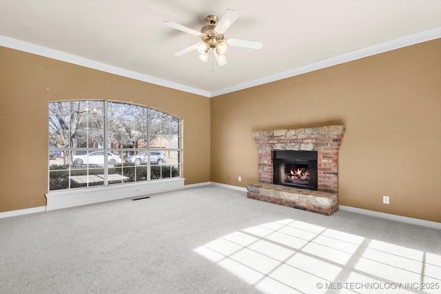 unfurnished living room with ornamental molding, carpet flooring, and a brick fireplace