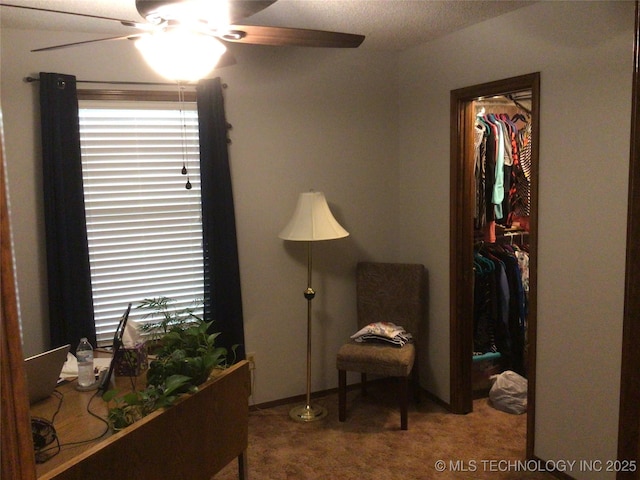 sitting room featuring carpet flooring and ceiling fan