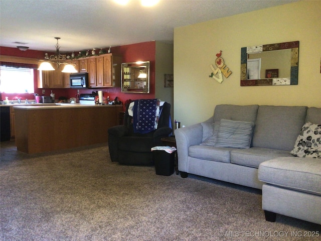 carpeted living room with a notable chandelier