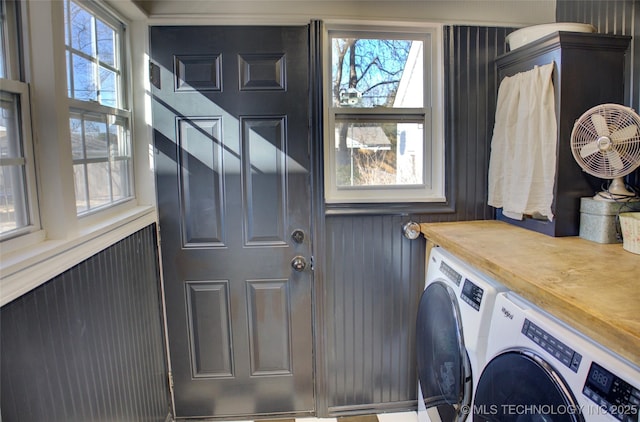 laundry area featuring washing machine and clothes dryer