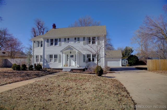 colonial inspired home with a garage