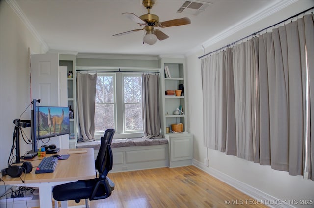 office featuring light hardwood / wood-style flooring, ornamental molding, and ceiling fan