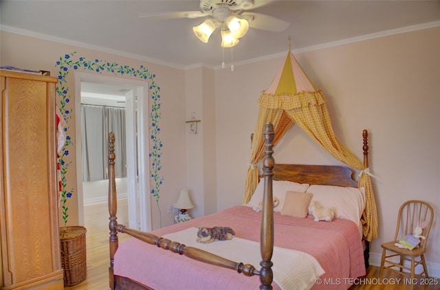 bedroom featuring hardwood / wood-style flooring, ceiling fan, and crown molding