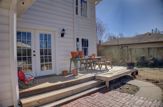 view of patio / terrace with a wooden deck and french doors