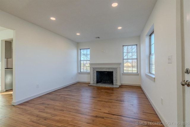 unfurnished living room with wood-type flooring