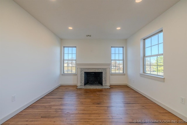 unfurnished living room featuring hardwood / wood-style flooring