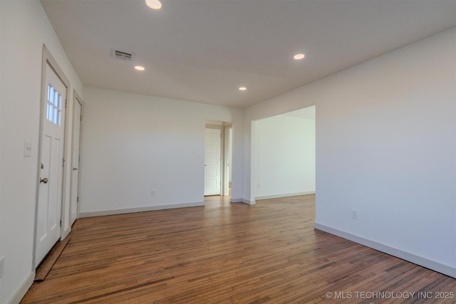 unfurnished room featuring hardwood / wood-style floors