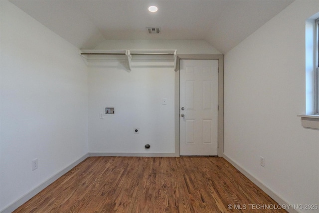 laundry area featuring hookup for a washing machine, dark hardwood / wood-style floors, and hookup for an electric dryer