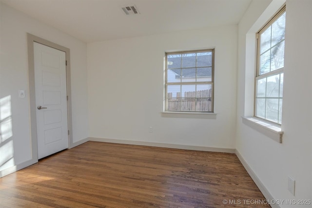 empty room with wood-type flooring