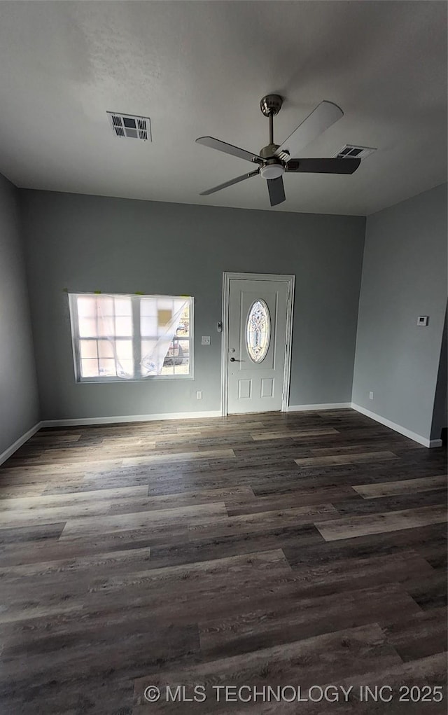 entryway with dark wood-type flooring and ceiling fan