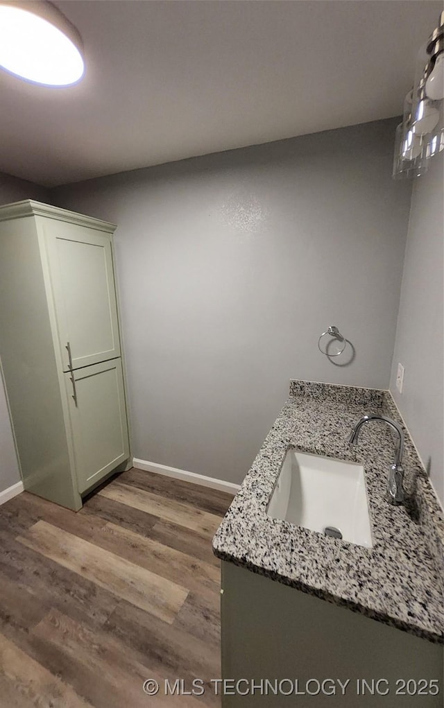 bathroom with hardwood / wood-style flooring and vanity