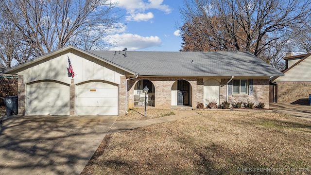 ranch-style home featuring a garage and a front yard