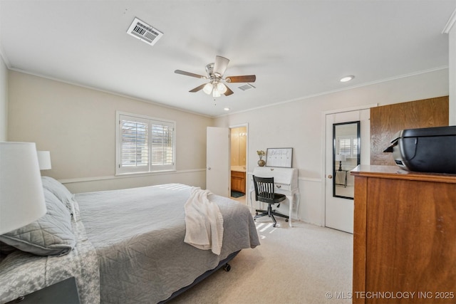 bedroom featuring ornamental molding, light colored carpet, and ceiling fan