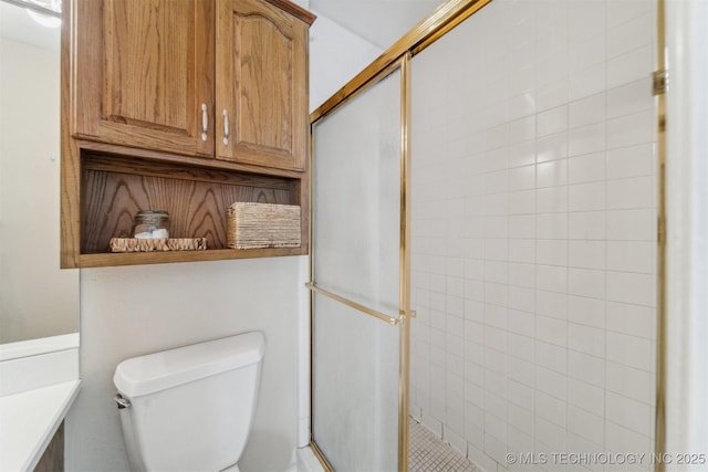 bathroom featuring toilet and walk in shower