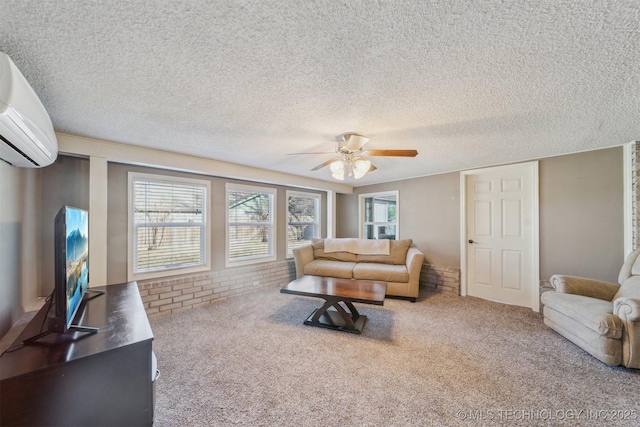 carpeted living room with a wall mounted air conditioner, a textured ceiling, and ceiling fan