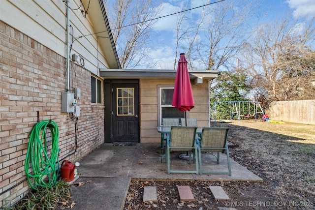 entrance to property with a patio