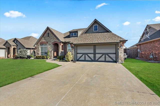 view of front of property with a garage and a front yard