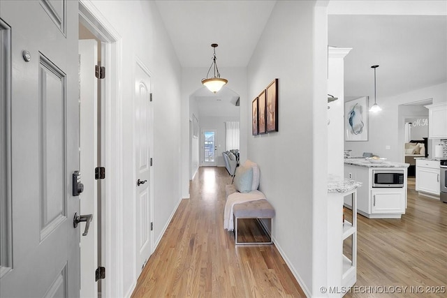 hall with light wood-type flooring