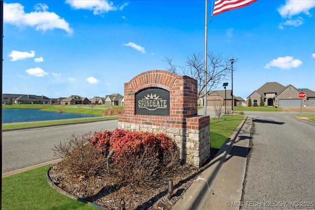 community sign with a water view