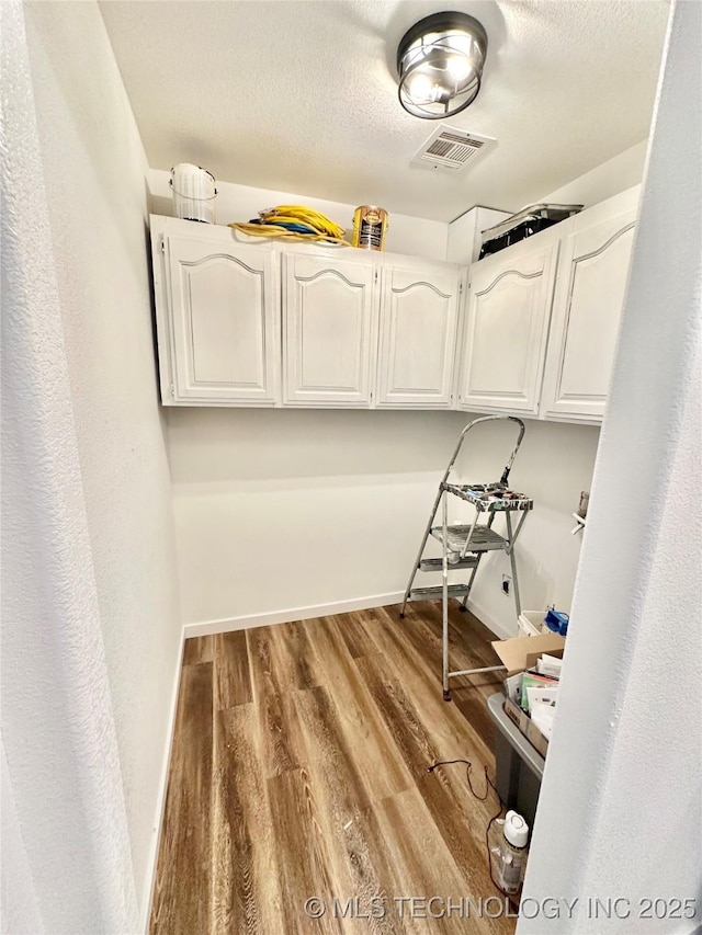 spacious closet with hardwood / wood-style floors