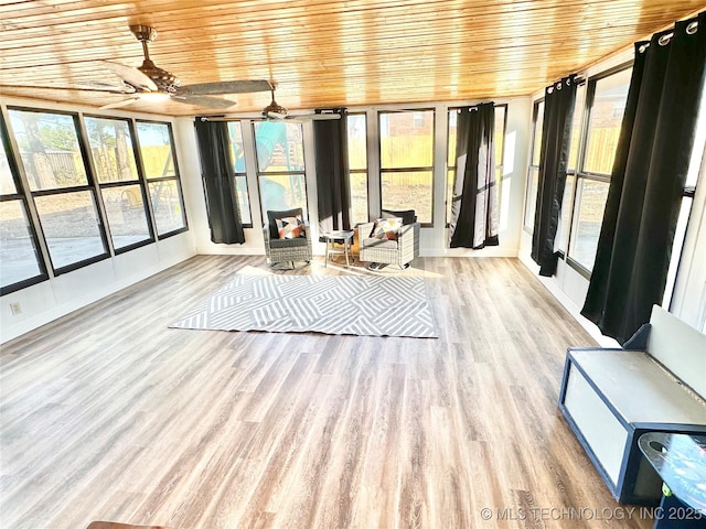 unfurnished sunroom with wood ceiling