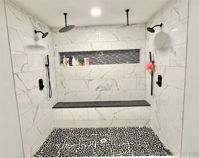 bathroom featuring tiled shower